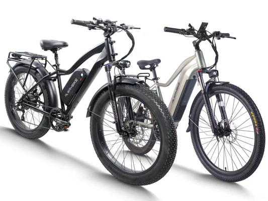 Studio comparison of two electric fat tire bikes, one black and one silver, showing step-through and high-step frame designs
